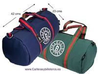 ROUND CANVAS TRAVEL OR SPORTS BAG WITH HANDLES AND MEDIUM-SIZED SHOULDER STRAP